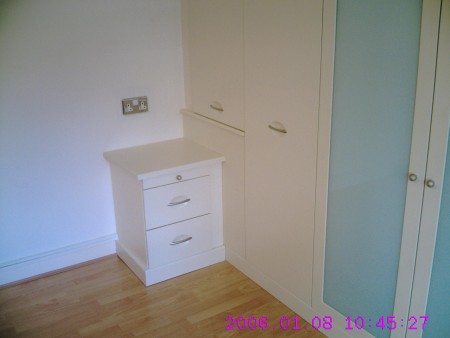 Bedside cabinet with stable door.